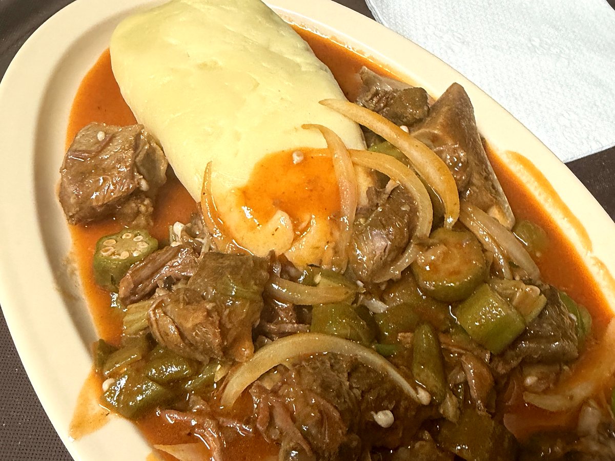 Fu fu with a rich stew of meat, okra, and onion at Ritho Caribbean Spot
