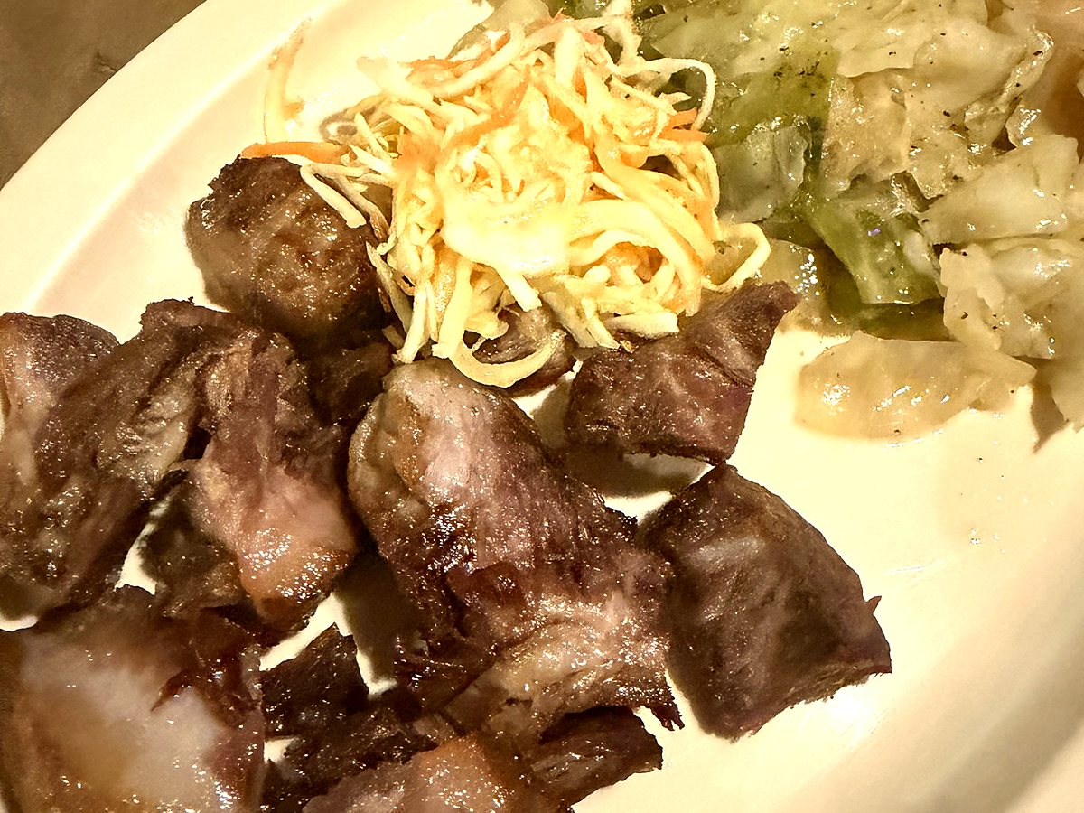 Haitian griot with pikliz and plantains